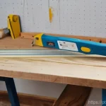 스툴 만들기 프로젝트 - **Prompt:** A cozy, naturally lit home workshop scene. A person (gender-neutral, wearing a practical...